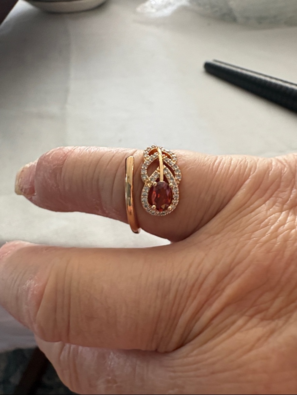 Gold-Tone Garnet Oval Halo Ring with Pavé Accents